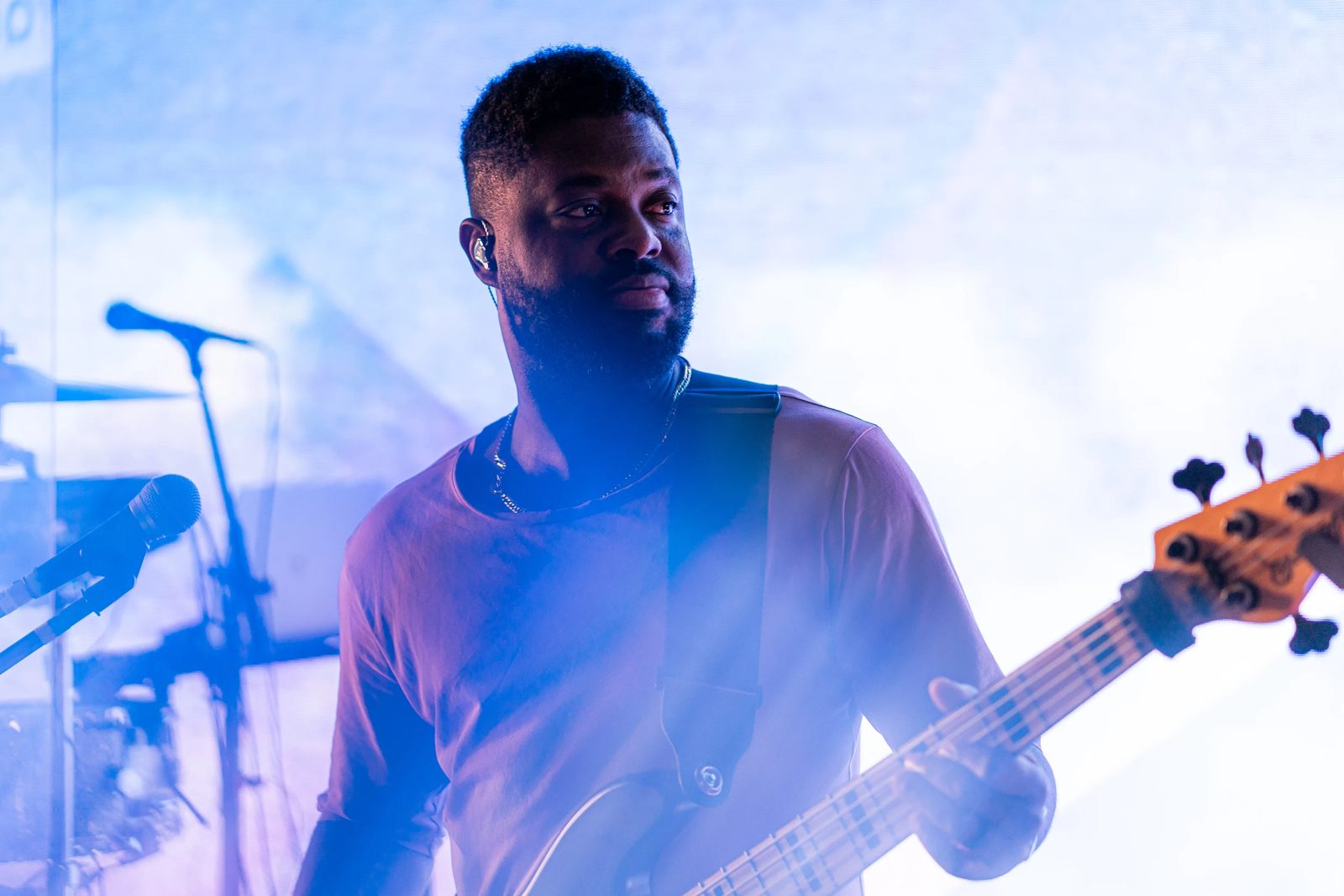 Bassist in blue haze on stage